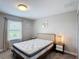 Relaxing bedroom with natural light, plush mattress, and neutral decor for a serene retreat at 850 Pebble Beach Dr, Davenport, FL 33896