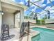 Outdoor screened-in pool and deck offer a relaxing retreat for leisure and entertainment at 850 Pebble Beach Dr, Davenport, FL 33896