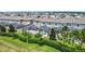 Aerial view of homes with screened-in pools and well-maintained green spaces, creating a private backyard oasis at 850 Pebble Beach Dr, Davenport, FL 33896
