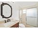 Clean bathroom featuring vanity, toilet and shower-tub combination with sliding glass doors at 9003 Pecky Cypress Way, Orlando, FL 32836