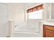 Bathroom featuring a soaking tub at 9003 Pecky Cypress Way, Orlando, FL 32836