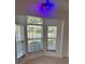 Bright bay window area with natural light and neutral tile floors at 9003 Pecky Cypress Way, Orlando, FL 32836