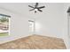 Bright bedroom with tile floor, ceiling fan, and natural light at 9003 Pecky Cypress Way, Orlando, FL 32836