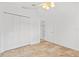 Bright bedroom with ensuite bathroom, ceiling fan, neutral walls, and large closet at 9003 Pecky Cypress Way, Orlando, FL 32836