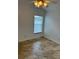 Bright bedroom with tile floors, window with blinds, and ceiling fan with light at 9003 Pecky Cypress Way, Orlando, FL 32836