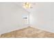 Bright, empty bedroom features tile floor, a window and a ceiling fan at 9003 Pecky Cypress Way, Orlando, FL 32836