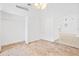 Bedroom with tile floor, walk-in closet with shelving, and access to adjacent living space at 9003 Pecky Cypress Way, Orlando, FL 32836
