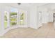 Sunny dining area with neutral tile flooring and large windows at 9003 Pecky Cypress Way, Orlando, FL 32836