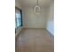 Bright dining area with modern chandelier and tiled flooring at 9003 Pecky Cypress Way, Orlando, FL 32836
