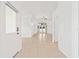 Spacious foyer with neutral tile flooring leading to the living areas at 9003 Pecky Cypress Way, Orlando, FL 32836