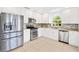 Modern kitchen featuring stainless steel appliances and granite countertops at 9003 Pecky Cypress Way, Orlando, FL 32836