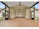 Large screened-in lanai featuring tiled floors and ceiling fans at 9003 Pecky Cypress Way, Orlando, FL 32836
