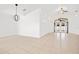 Open living room with high ceilings and a view of the backyard at 9003 Pecky Cypress Way, Orlando, FL 32836
