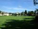 View of a community park with playground area and green space at 9003 Pecky Cypress Way, Orlando, FL 32836