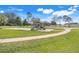 View of a community playground with swings and slide, a sunny day at 9003 Pecky Cypress Way, Orlando, FL 32836