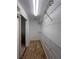 Spacious walk-in closet with shelving for ample storage space and ceramic tile floor at 9003 Pecky Cypress Way, Orlando, FL 32836