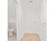 Spacious walk-in closet featuring neutral paint, shelving and tile flooring at 9003 Pecky Cypress Way, Orlando, FL 32836