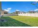 Large backyard with a well-maintained lawn and privacy fence, providing plenty of space for recreation and enjoyment at 913 Sabal Breeze Ln, Apopka, FL 32703