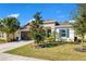 Beautiful single-story home with a 2-car garage, lush lawn, and decorative shutters at 913 Sabal Breeze Ln, Apopka, FL 32703