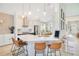 Bright kitchen featuring stainless steel appliances, an island with bar seating and open floor plan at 913 Sabal Breeze Ln, Apopka, FL 32703