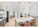 Bright kitchen featuring stainless steel appliances, an island with bar seating and open floor plan at 913 Sabal Breeze Ln, Apopka, FL 32703
