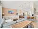 Bright living room with bar seating, stainless steel appliances and a comfortable sofa at 913 Sabal Breeze Ln, Apopka, FL 32703