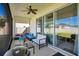 Inviting screened patio area furnished with comfortable seating, a grill, and outdoor decor, perfect for relaxing outdoors at 913 Sabal Breeze Ln, Apopka, FL 32703