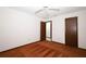 Bedroom with neutral walls, ceiling fan, and two doors into other rooms at 9206 Everwood St, Orlando, FL 32825