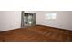 This is a bright bedroom with sliding glass doors and a large window, allowing for plenty of natural light at 9206 Everwood St, Orlando, FL 32825