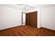 Bedroom with neutral walls, ceiling fan, and closet with folding doors at 9206 Everwood St, Orlando, FL 32825