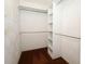 This walk-in closet provides ample storage space with shelving and hanging rods at 9206 Everwood St, Orlando, FL 32825