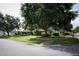 Charming single-story home with a well-manicured lawn and mature trees at 9206 Everwood St, Orlando, FL 32825