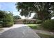 Single-story home with a well-maintained lawn and a long driveway at 9206 Everwood St, Orlando, FL 32825