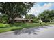Charming single-story home with mature trees and well-manicured landscaping at 9206 Everwood St, Orlando, FL 32825