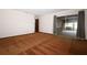 Bright living room with brown carpet, sliding glass doors to a screened-in patio at 9206 Everwood St, Orlando, FL 32825