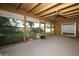 Enclosed carpeted sunroom with wood-paneled ceiling, ceiling fan, and sliding glass door offering backyard view at 9206 Everwood St, Orlando, FL 32825