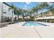 Community pool with lounge chairs and well-maintained landscaping at 958 Salt Pond Pl # 103, Altamonte Springs, FL 32714
