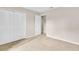 Spacious bedroom with neutral carpeting, large closet, and abundant natural light at 978 Calanda Ave, Orlando, FL 32807