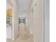 Bright hallway with tile flooring, decorative medallion and neutral paint, and views to other rooms at 978 Calanda Ave, Orlando, FL 32807