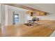 Eat-in kitchen featuring wood cabinets and stainless steel sink at 978 Calanda Ave, Orlando, FL 32807