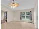 Bright living room featuring tile flooring, a ceiling fan, and a large window at 978 Calanda Ave, Orlando, FL 32807