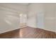 Living room with laminate floors and view to additional space at 978 Calanda Ave, Orlando, FL 32807