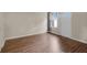 Wood-look vinyl flooring in this room featuring a window and exterior door at 978 Calanda Ave, Orlando, FL 32807