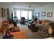 Cozy living room featuring neutral tones, large windows for natural light, and comfortable seating arrangements at 1031 S Hiawassee Rd # 2514, Orlando, FL 32835