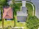 An aerial view showing the home's roof and placement on a well-maintained, grassy lot at 1044 Dees Dr, Oviedo, FL 32765