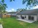 Spacious backyard with lush green grass, patio and privacy fence at 1044 Dees Dr, Oviedo, FL 32765