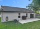 Backyard with green grass and patio at 1044 Dees Dr, Oviedo, FL 32765