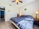 Cozy bedroom with ceiling fan, wood floor and ample closet space at 1044 Dees Dr, Oviedo, FL 32765