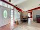 Bright foyer featuring tile flooring, a unique glass block partition, and a view into the adjacent dining area at 1044 Dees Dr, Oviedo, FL 32765