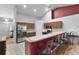 Modern kitchen featuring stainless steel appliances, granite countertops, and ample cabinet space at 1113 Canopy Oaks Dr, Minneola, FL 34715